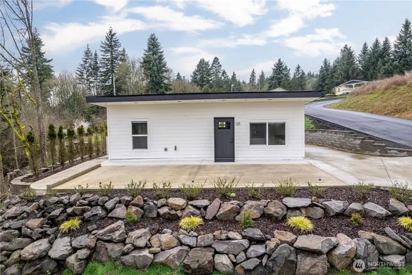 a front view of a house with a yard
