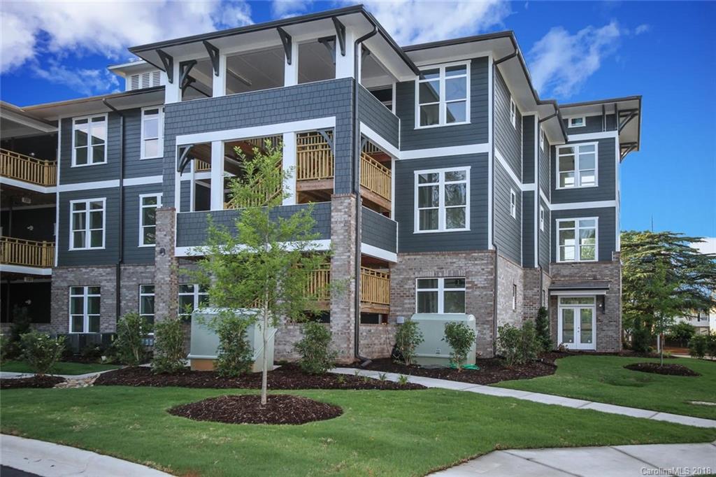 935 McAlway Road, Unit 201 Charlotte, NC 28211 - Photo 1 of 21 front view of a building with a yard