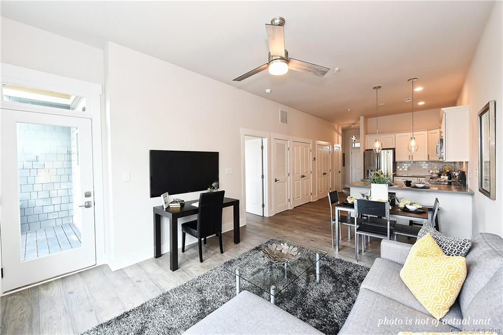 935 McAlway Road, Unit 201 Charlotte, NC 28211 - Photo 11 of 21 a living room with furniture and a flat screen tv