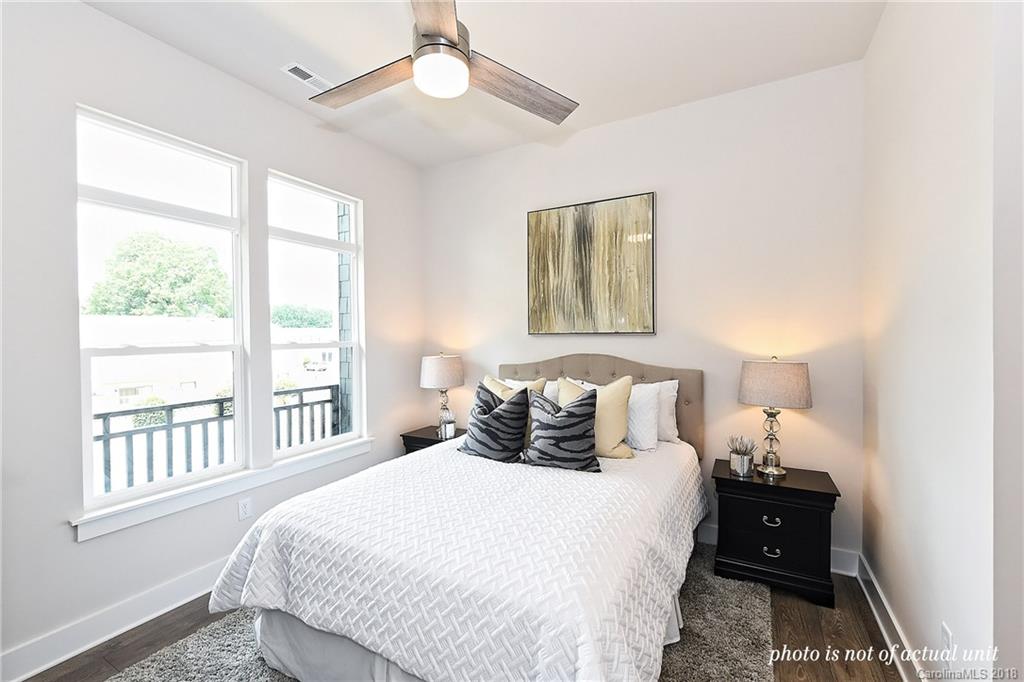 935 McAlway Road, Unit 201 Charlotte, NC 28211 - Photo 13 of 21 a bedroom with a bed and a window