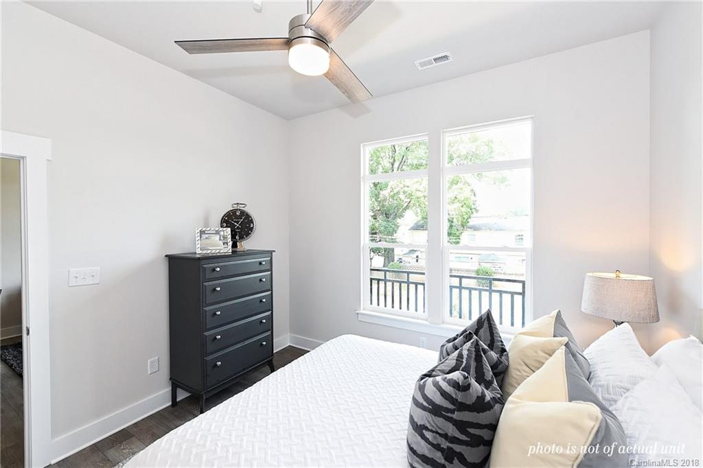 935 McAlway Road, Unit 201 Charlotte, NC 28211 - Photo 15 of 21 a bedroom with a bed and a window