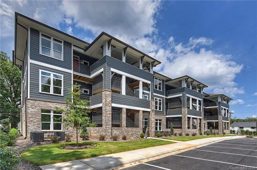 935 McAlway Road, Unit 201 Charlotte, NC 28211 - Photo 20 of 21 a large building with a clock on the side of it