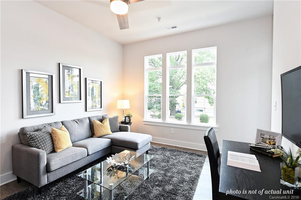 935 McAlway Road, Unit 201 Charlotte, NC 28211 - Photo 10 of 21 a living room with furniture and a large window