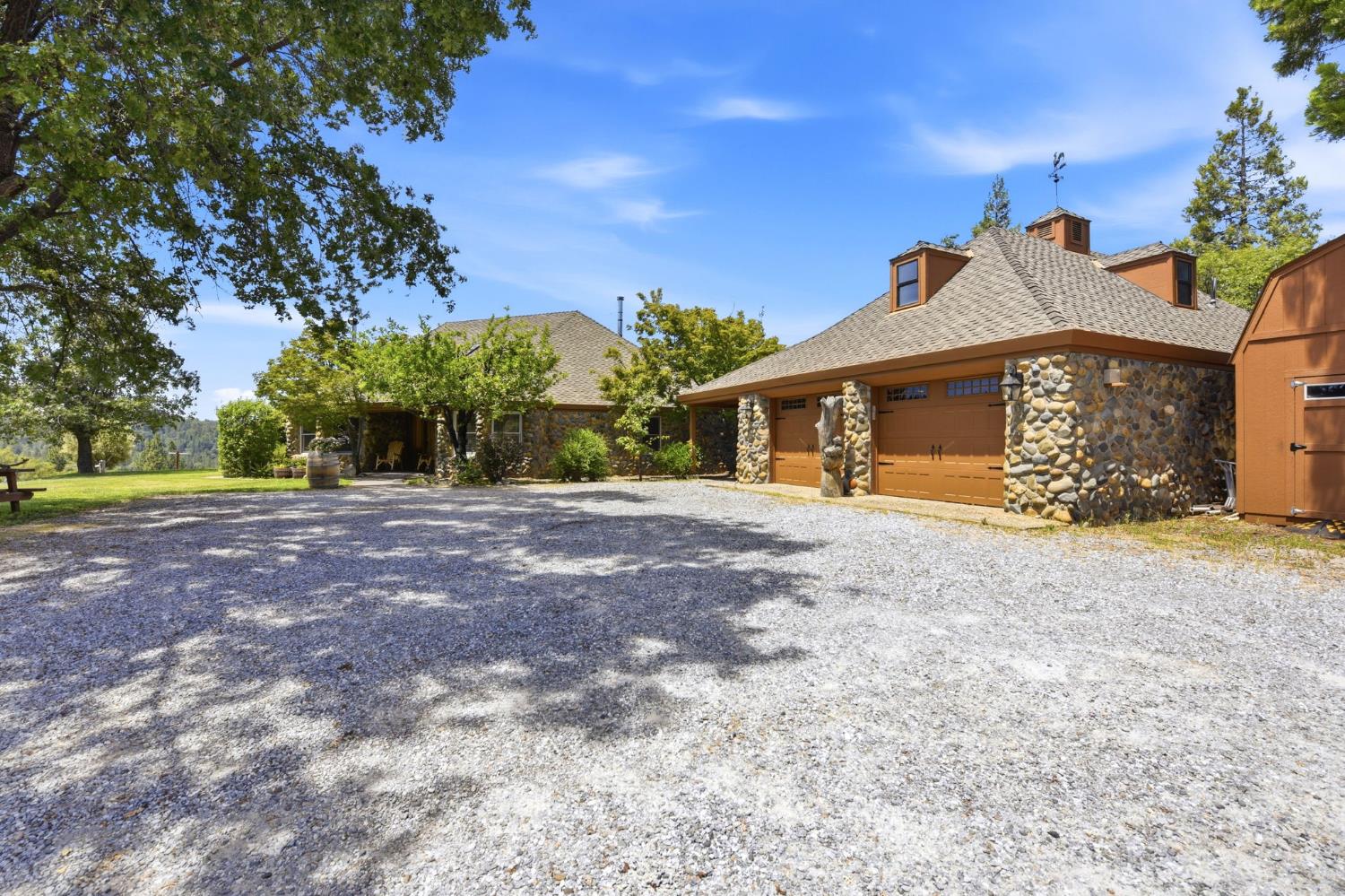 7201 Happy Valley Road Somerset, CA 95684 - Photo 61 of 75 Stone-clad siding with multiple gabled rooflines
