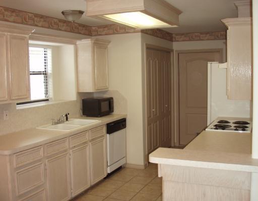 8001 Rock Crest Drive Corpus Christi, TX 78414 - Photo 2 of 4 a bathroom with a sink and a mirror