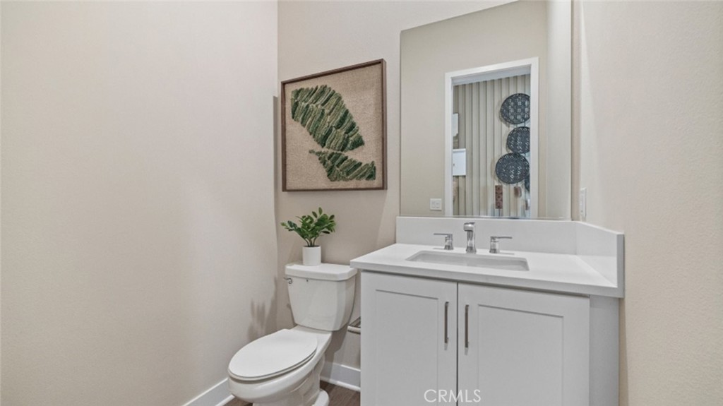 29503 Corte Azulejo Valencia, CA 91354 - Photo 14 of 34 a bathroom with a toilet sink and mirror