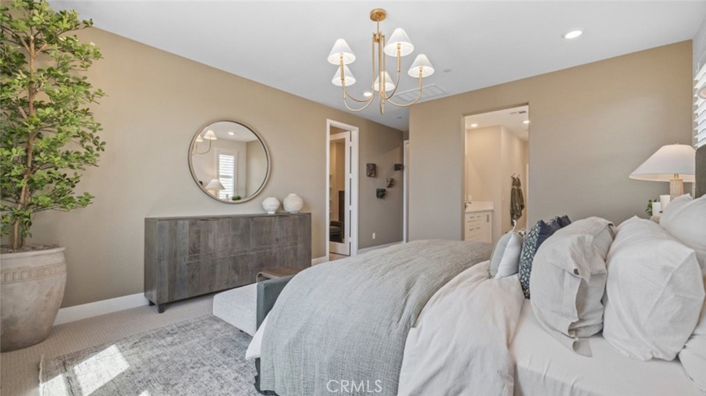 29503 Corte Azulejo Valencia, CA 91354 - Photo 16 of 34 a bedroom with bed and a chandelier
