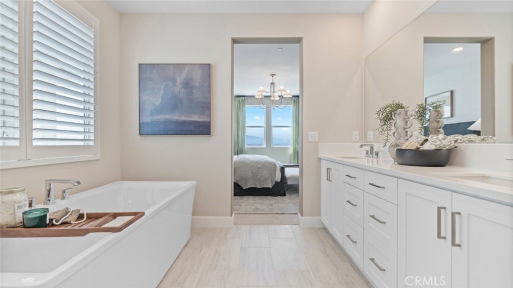 29503 Corte Azulejo Valencia, CA 91354 - Photo 19 of 34 a en suite bathroom with a double vanity sink and a mirror