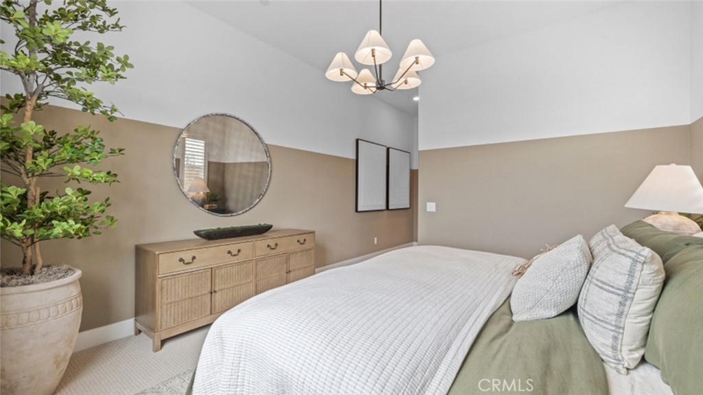 29503 Corte Azulejo Valencia, CA 91354 - Photo 22 of 34 a bedroom with a bed and a chandelier