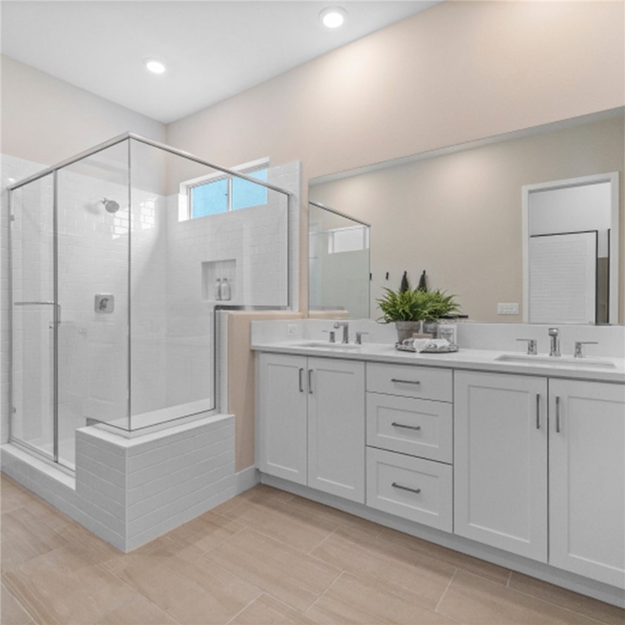 29503 Corte Azulejo Valencia, CA 91354 - Photo 23 of 34 a bathroom with a double vanity sink a large mirror and shower