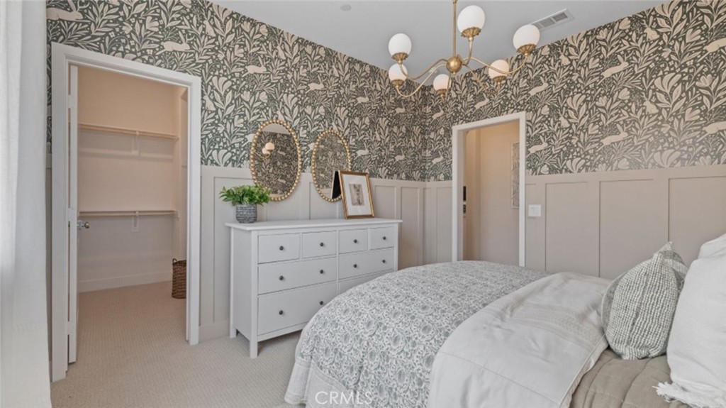 29503 Corte Azulejo Valencia, CA 91354 - Photo 25 of 34 a bedroom with a bed and a dresser