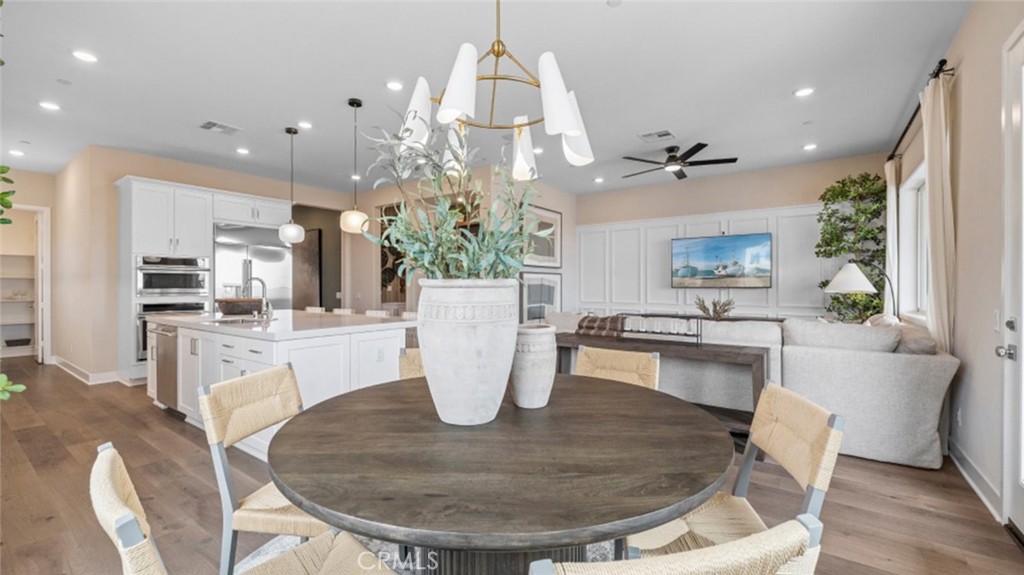 29503 Corte Azulejo Valencia, CA 91354 - Photo 9 of 34 a dining room with furniture and a chandelier
