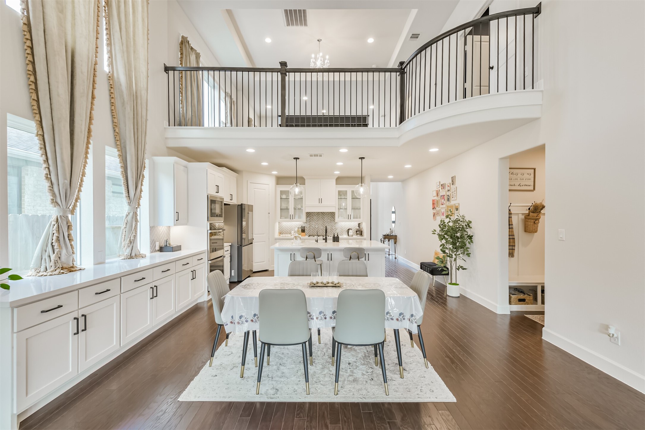19319 Wild Sabino Way Tomball, TX 77377 - Photo 11 of 46 a view of a dining room with furniture window and wooden floor