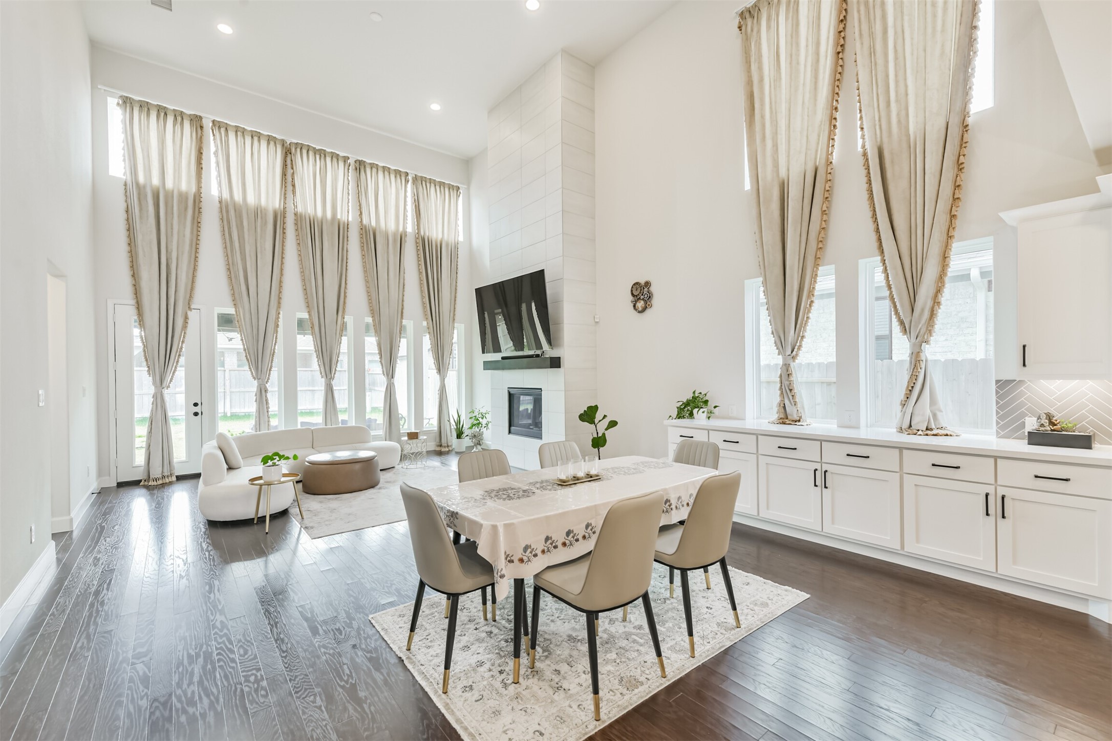 19319 Wild Sabino Way Tomball, TX 77377 - Photo 12 of 46 a view of a a dining room with furniture window and wooden floor