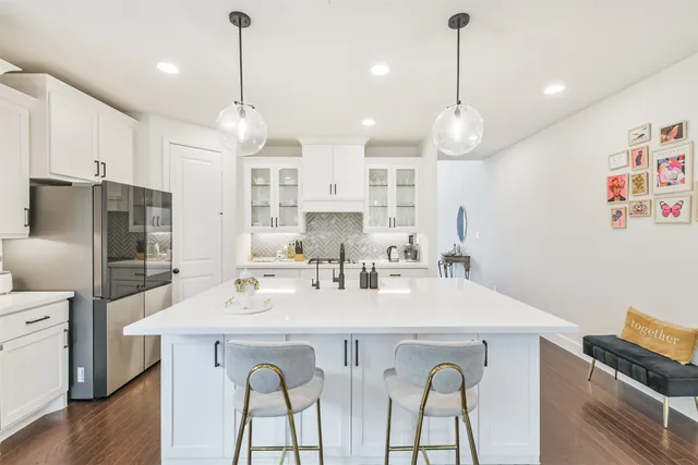 a spacious bathroom with a sink a large mirror and a shower