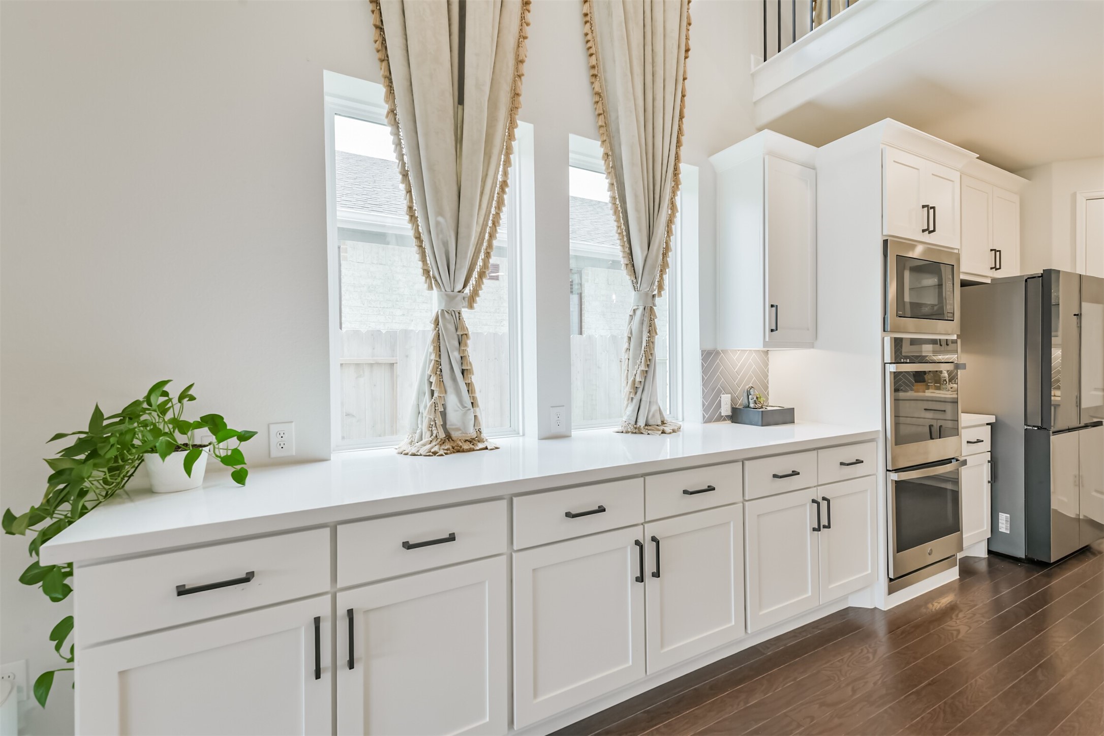 19319 Wild Sabino Way Tomball, TX 77377 - Photo 19 of 46 a kitchen with stainless steel appliances white cabinets and a window