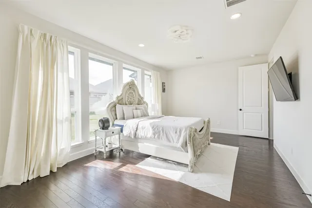 a white bath tub sitting in a en suite bathroom