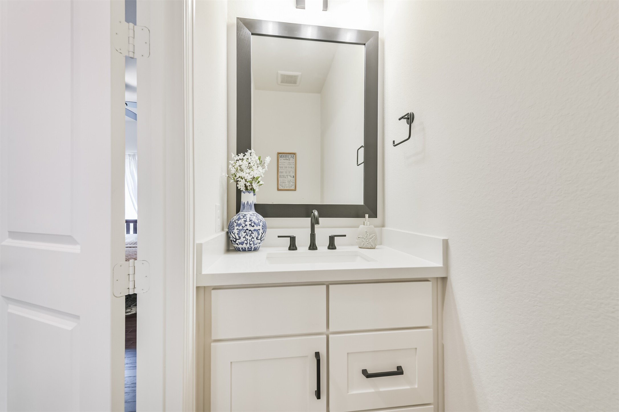 19319 Wild Sabino Way Tomball, TX 77377 - Photo 27 of 46 a bathroom with a sink vanity and a mirror