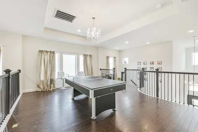 a view of a livingroom with furniture window and wooden floor