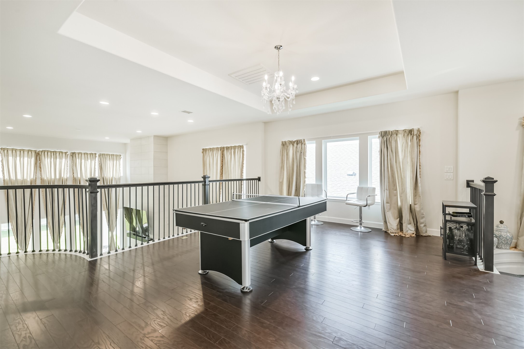 19319 Wild Sabino Way Tomball, TX 77377 - Photo 34 of 46 a view of a livingroom with furniture window and wooden floor