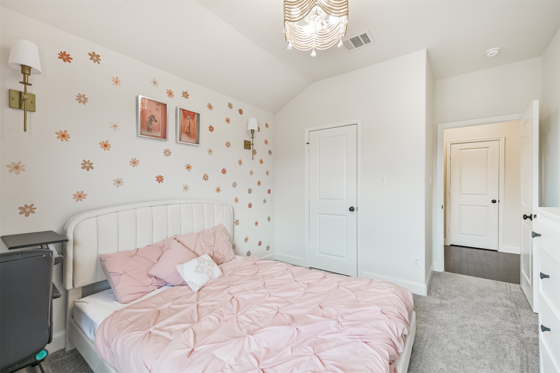 19319 Wild Sabino Way Tomball, TX 77377 - Photo 38 of 46 a bedroom with a bed and a chandelier