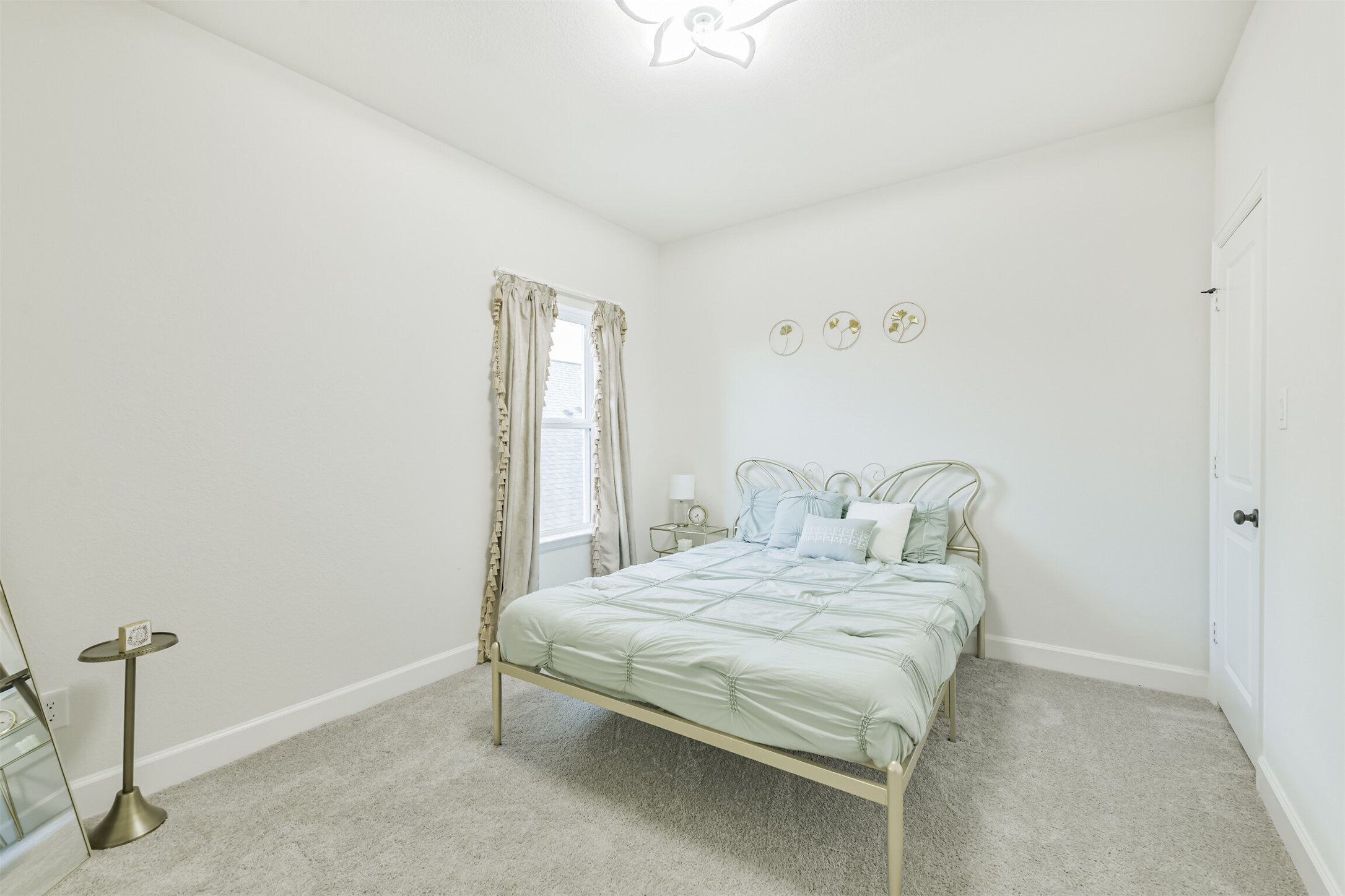 19319 Wild Sabino Way Tomball, TX 77377 - Photo 40 of 46 a bedroom with a bed and a table