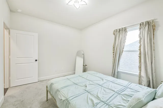 a utility room with cabinets washer and dryer