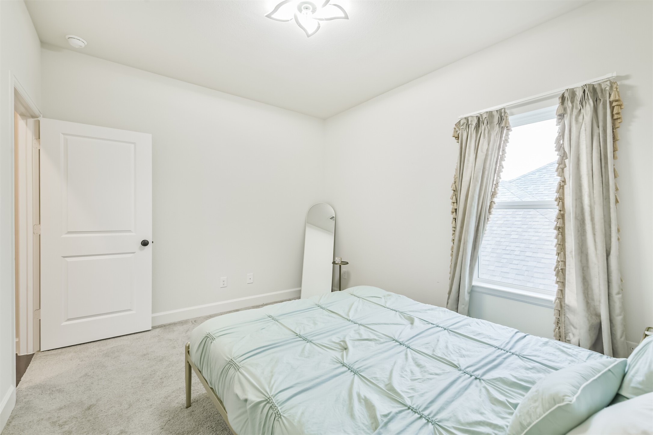 19319 Wild Sabino Way Tomball, TX 77377 - Photo 41 of 46 a bedroom with a bed and a window