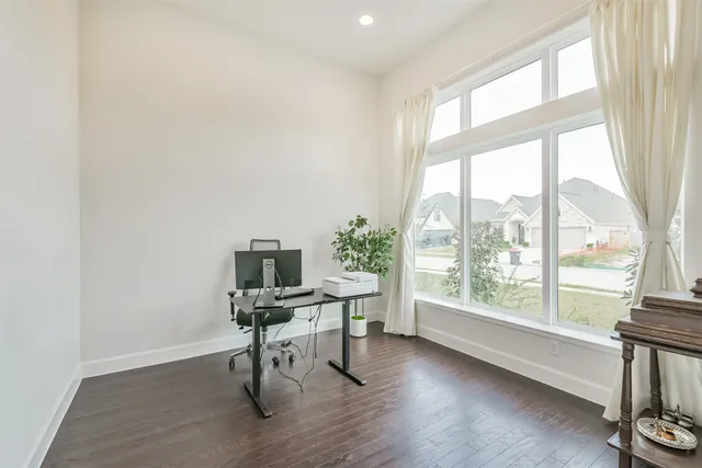 a workspace with furniture and a potted plant