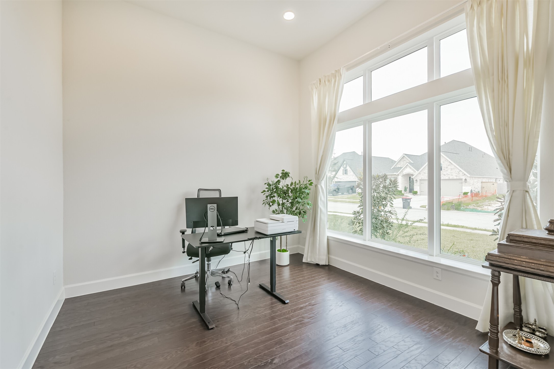 19319 Wild Sabino Way Tomball, TX 77377 - Photo 5 of 46 a view of a workspace with furniture and a window