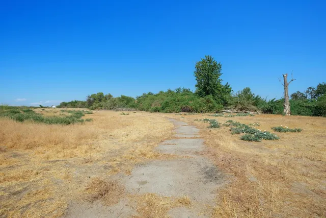 a view of lake with green space