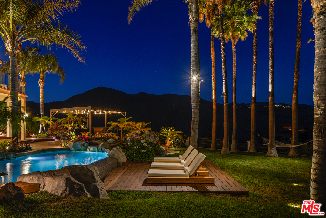 5868 Zumirez Drive Malibu, CA 90265 - Photo 18 of 54 a front view of a house with garden