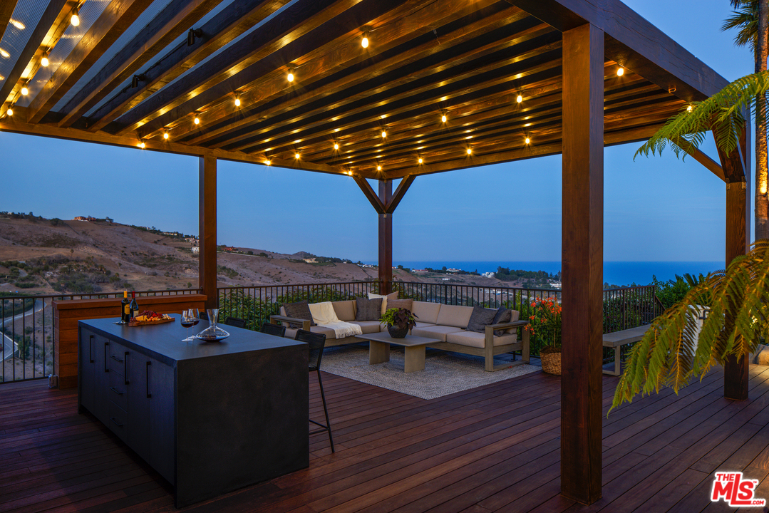 5868 Zumirez Drive Malibu, CA 90265 - Photo 22 of 54 a outdoor space with patio lots of furniture