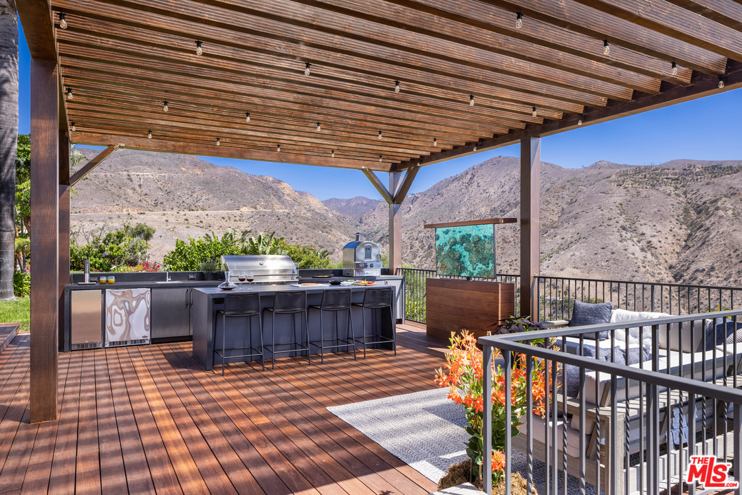 5868 Zumirez Drive Malibu, CA 90265 - Photo 23 of 54 a view of a balcony with furniture