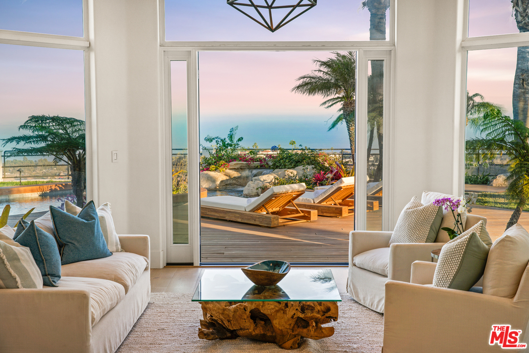 5868 Zumirez Drive Malibu, CA 90265 - Photo 30 of 54 a living room with furniture and a large window