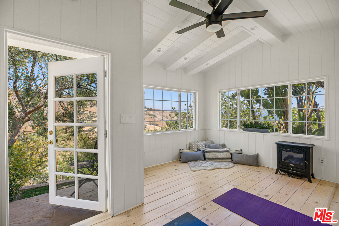 5868 Zumirez Drive Malibu, CA 90265 - Photo 44 of 54 a living room with furniture and a fireplace