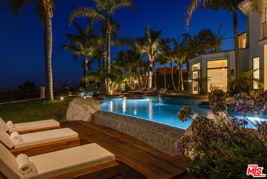 5868 Zumirez Drive Malibu, CA 90265 - Photo 49 of 54 a view of a yard with plants and a fountain