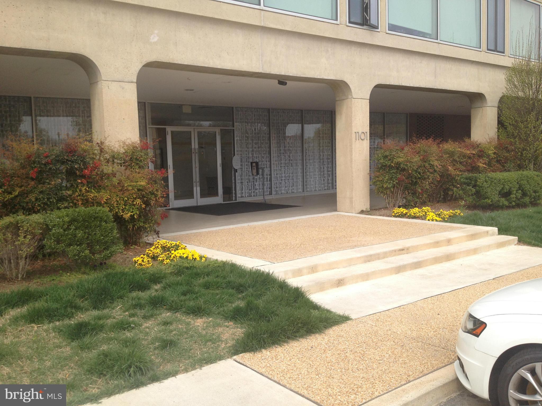 1101 3rd Street Southwest, Unit 210 Washington, DC 20024 - Photo 2 of 28 a view of a house with a yard