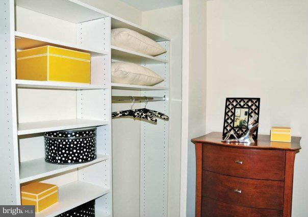 1101 3rd Street Southwest, Unit 210 Washington, DC 20024 - Photo 18 of 28 a bathroom with a sink a mirror and a shower