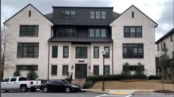 a view of a street that has couple of cars parked on the road