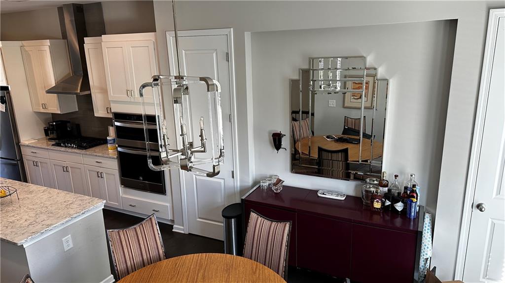 6428 Canopy Drive Sandy Springs, GA 30328 - Photo 11 of 35 a kitchen with a sink stove and refrigerator