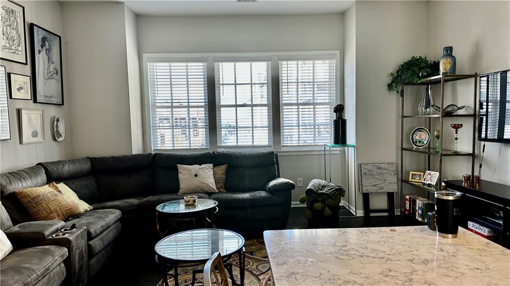 6428 Canopy Drive Sandy Springs, GA 30328 - Photo 13 of 35 a living room with furniture and wooden floor