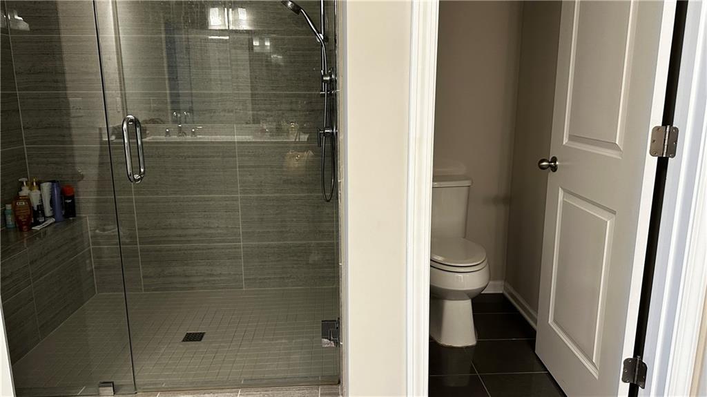 6428 Canopy Drive Sandy Springs, GA 30328 - Photo 20 of 35 a bathroom with a toilet and a shower