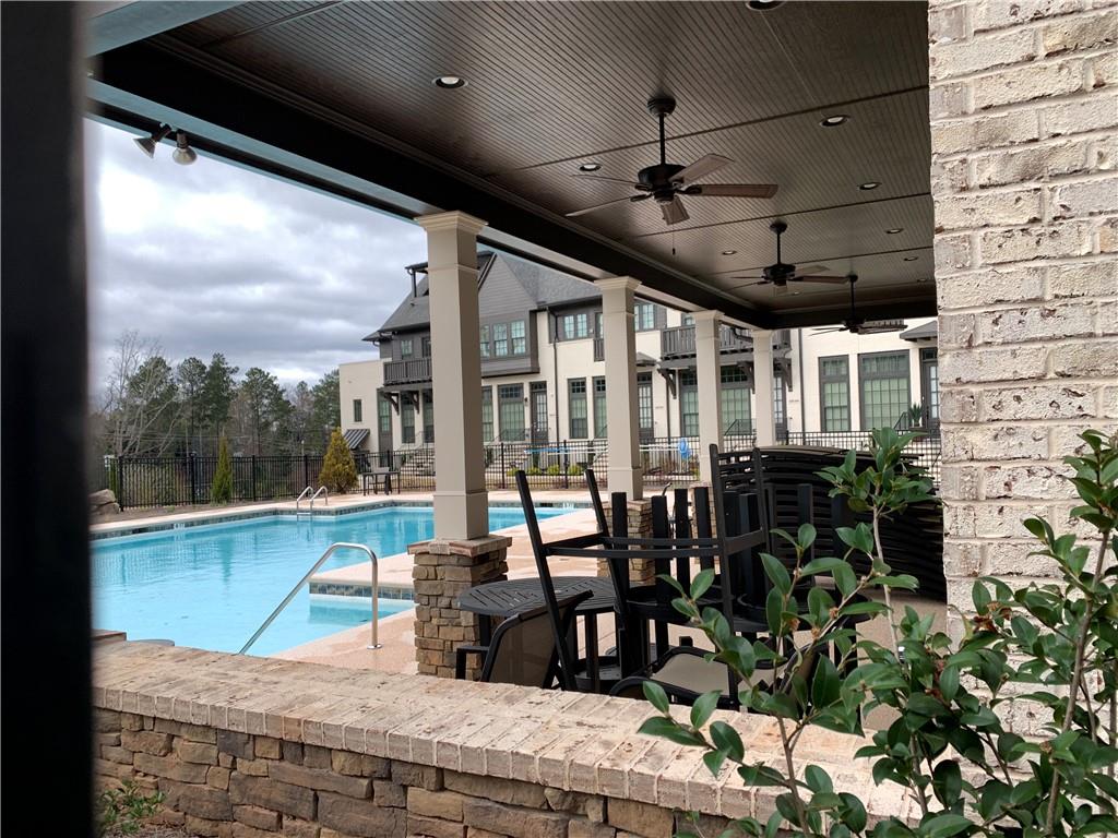 6428 Canopy Drive Sandy Springs, GA 30328 - Photo 29 of 35 a building outdoor space with patio furniture and potted plants