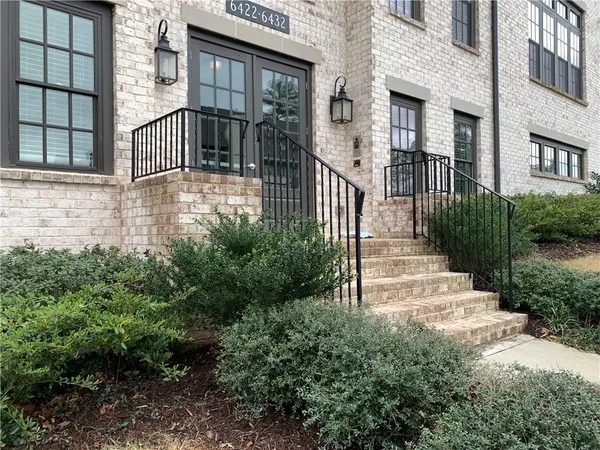 a view of a street with a building in the background