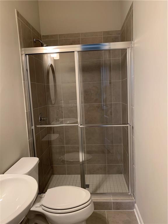 6428 Canopy Drive Sandy Springs, GA 30328 - Photo 9 of 35 a bathroom with a toilet and a shower