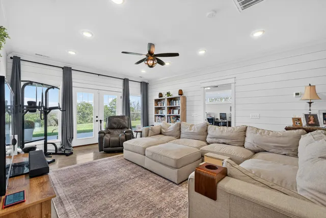 a bedroom that has a bed and a table in it