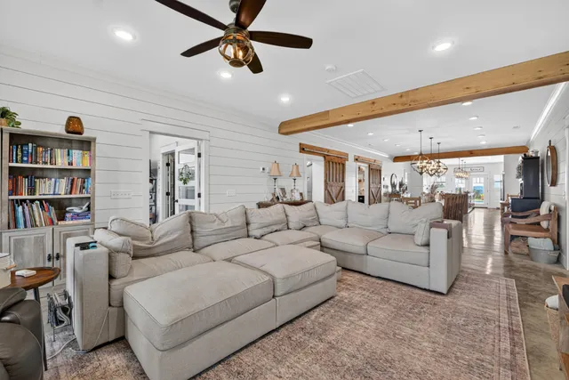 a bedroom with furniture and a flat screen tv