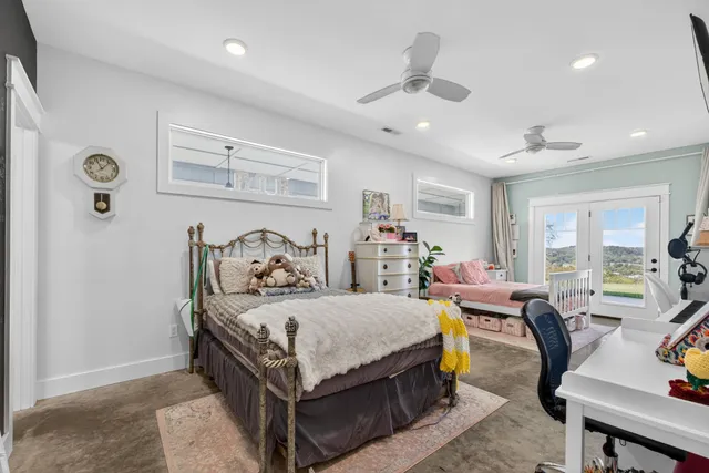 a table with a clock and a mirror on the wall