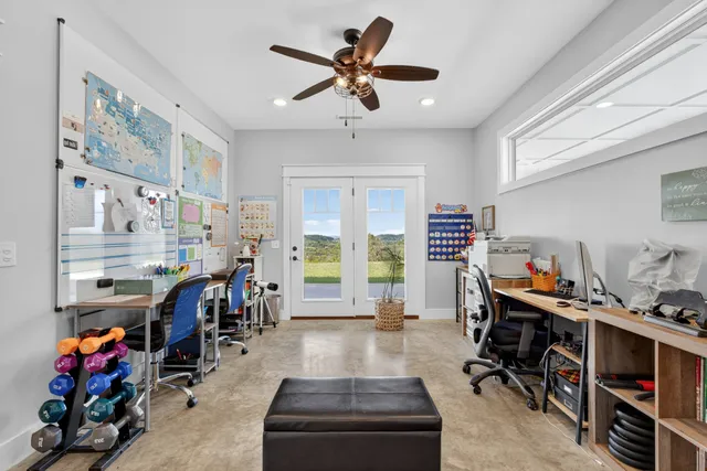 an aerial view of a houses with a yard